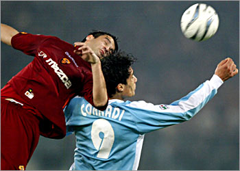 Roma forward Brenardo Corradi fights for the ball Lazio defender Christian Chivu, during their Italian L1 match Lazio-As Roma, 21 March 2004, at the Olympic Stadium in Roma. AFP PHOTO PHILIPPE DESMAZES