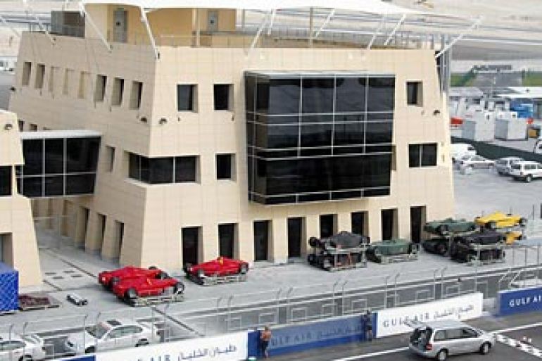 f: Formula One cars are parked next to the race control tower 27 March 2004 as preparations get underway at the race track where the Bahrain Grand Prix will be held 04-06 April in Sakhir