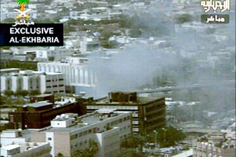 A video grab shows smokes from a building after a car bomb explosion that targeted a government security building in the Saudi capital Riyadh, April 21, 2004. At least ten people were killed and dozens wounded in a car bomb explosion that wrecked a government building housing Saudi security forces on Wednesday, witnesses said. SAUDI ARABIA OUT REUTERS/Al Ekhbaria