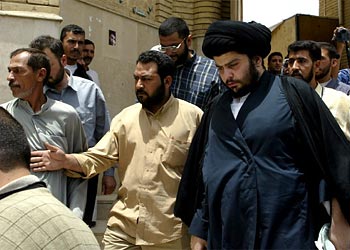 f: Wanted Iraqi cleric Moqtada Sadr enters Kufa mosque to perform Friday noon prayers in the city of Kufa, south of Baghdad,