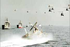f: File pictures dated 29 October 2000 shows Iranian army helicopters and Navy boats taking part in maneuvers in the Strait of Hormuz. The Iranian navy has seized three British naval boats alleged to have entered its territorial waters on the Iraqi border