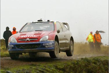 Race leader French Citroen driver Sebastien Loeb competes in stage 10 of the World Rally Championships Wales 18 September 2004. AFP PHOTO/CARL DE SOUZA