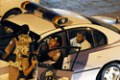 A man is seen sitting in the back of a police car after being arrested in the port city of Jeddah late 22 April 2004. Saudi security forces shot dead three militants during a clash in the city last night, including two figuring on a list of most wanted terror suspects,