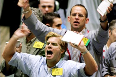 REUTERS - Traders bargain in the oil pit at the New York Mercantile Exchange on September 28, 2004. Oil prices raced to new