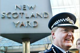 AFP - Sir Ian Blair speaks to the media infront of Scotland Yard in London 28, October, 2004, after it was announced he would