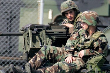 U.S. soldiers sit on an armed vehicle at an army base in Tongduchon,