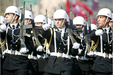 REUTERS - Turkish Navy cadets march through a main boulevard in Istanbul October 29, 2004, during a parade marking the