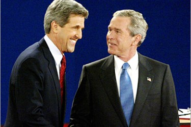 REUTERS - U.S. President George W. Bush (R) shakes hands with Democratic presidential nominee John Kerry before the start