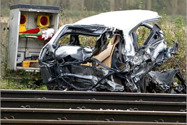 AFP - The remains of a car lies beside the track the morning after a high-speed train hit the car on a crossing in the village of