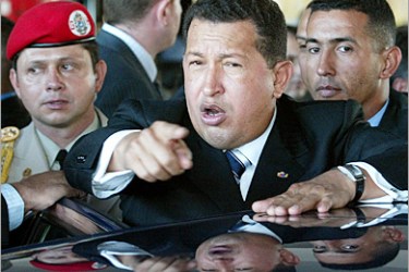 AFP- The President of Venezuela, Hugo Chavez speaks with his compatriots after his visit 21 November 2004 in Atocha's