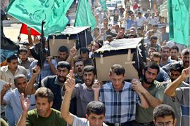 AFP - Palestinian mourners carry the bodies of two Islamic Jihad militants Omar Nofal and Ramzi Jaabeer during their funeral