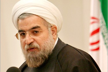 REUTERS - Iran's chief nuclear negotiator Hassan Rohani speaks with journalists in Tehran November 30, 2004. Iran reiterated on