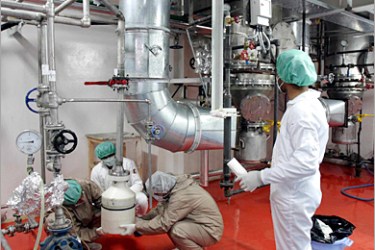 REUTERS - Employees work in the Isfahan nuclear facility 400 kilometers south of Tehran November 20, 2004. Iran promised to meet