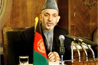 AFP - Afghan President Hamid Karzai addresses a press conference in Kabul, 24 December 2004. Karzai said his