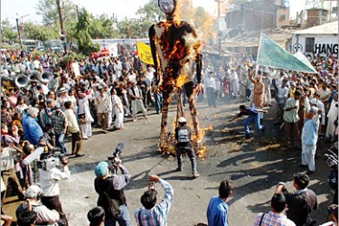 AFP - Survivors of the Bhopal gas tragedy and activists set on fire a giant effigy representing Union Carbide chemical company,
