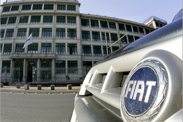 REUTERS/ Fiat car is parked in front of the Fiat headquarters in Turin January 24, 2005. Fiat will not exercise an option to sell its