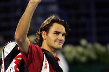 afp - Roger Federer of Switzerland waves to the crowd after winning the ATP semi-final match against US Andre Agassi in Dubai 26 February 2005