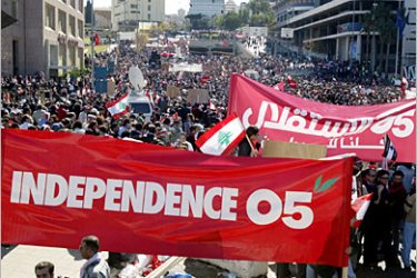 Lebanese pro-opposition protestors demonstrate against Syria in central Beirut 21 February 2005. Tens of thousands of people massed on the Lebanese capital's seafront chanting "Syria out" as the pressure mounted on the government and its backers in Damascus a week after the assassination of former premier Rafiq Hariri. AFP PHOTO/JOSEPH BARRAK