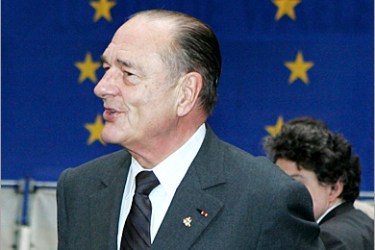 AFP - French President Jacques Chirac arrives for a EU summit 22 March 2005, in Brussels. Plans to free up Europe's vast services sector cast a cloud over EU summit talks Tuesday,