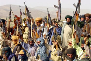 Militant Marri Baloch tribemen, carry their weapons during routine training  in the autonomous region of Kohlu in the south-east of Balochistan province in this photo taken July 25, 2004.