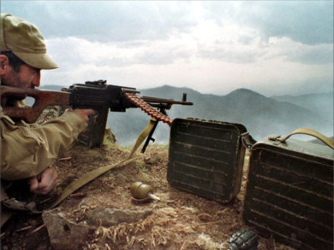 This picture dated April 1993, shows Armenian soldier, aiming at his position at a frontline with Azrbaijan troops not far from the town of Hadrut, Nagorny Karabakh