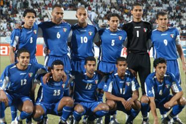 Kuwait's national soccer team pose for a picture before their World Cup 2006 qualifying match against Uzbekistan in Kuwait City, 25 March 2005.
