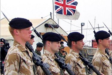 British soldiers stand in formation during a handover ceremony at the Dutch military camp in the southern Iraqi city of Samawa March 7, 2005. Dutch forces in Iraq officially handed over command of their Camp Smitty base in the southern Iraqi city of Samawa to British troops on Monday, marking the end of the 20-month Dutch mission in the country. REUTERS/Mohammed Ameen