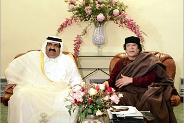 AFP - Libyan Leader Moamer Kadhafi (R) meets with Qatar's Emir Sheikh Hamad bin Khalifa al-Thani on the sidelines of the 17th Arab Summit in Algiers 22 March 2005. Arab leaders open