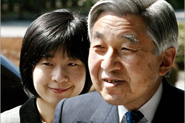 Japan's Princess Nori (L) smiles with her father, Emperor Akihito, as they arrive at an Imperial Palace museum in Tokyo, 18 March 2005. An imperial court ceremony for Princess Nori's engagement will be held 19 March. AFP PHOTO/Toru Hanai/POOL