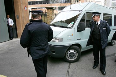 AFP - A police van arrives at the Special Immagration Appeal Comission in London 11 March, 2005 a foreign terrorism suspect who was granted bail. A British judge granted bail