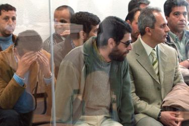 f/Some of the suspected members of Al-Qaeda wait for the beginning of Europe's biggest trial against suspected members of the Al Qaeda network at Madrid's High court, 22 April 2005.