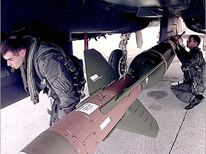 AFP(FILES) This US Air Force file image obtained 12 March 2003 shows pilots checking the GBU-28 "bunker Buster" a 5,000lb