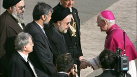 f_Bishop James Harvey (R) welcomes Iranian President Mohammad