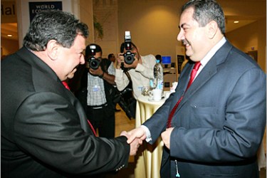AFP - Israeli Minister of National Infrastructure Benjamin Ben Eliezer (L) shakes hands with Iraqi Foreign Minister Hoshyar Zebari at the World Economic Forum in the Jordanian Dead