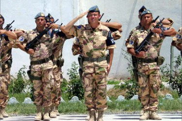 Troops from the Nato-led International Security Assistance Force (ISAF) salute during a ceremony of the transfer of command in the western city of Herat, Afghanistan May 31, 2005. NATO troops took command of security and reconstruction efforts in western Afghanistan from U.S. forces on Tuesday under a plan that will likely soon put NATO forces into insurgent hot spots.