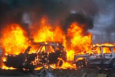 r_Sport utility vehicles are consumed by flames at the scene of a powerful car
