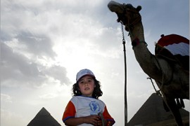 AFP - A young Egyptian girl takes part in a march against hunger 12 June, 2005 at the Pyramids in Giza, during an event organised by the United Nations' World Food Programme
