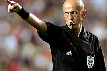 r_Referee Pierluigi Collina whistles a foul during the World Cup European Zone Group Three qualifying match between Slovakia and Portugal at the Luz stadium in Lisbon June 4, 2005. Portugal won 2-0.  REUTERS/ Nacho Doce