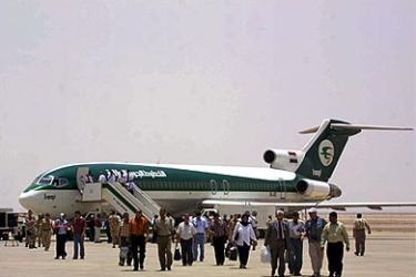 f: Passengers arrive on one of the first internal Iraqi Airways commercial flights to Basra International Airport, 500 kms from Baghdad, 500 kms north