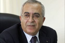 afp - Palestinian finance minister Salam Fayad works at his offices in the West Bank town of Ramallah, 12 June 2005. Fayad has won praise from the United States