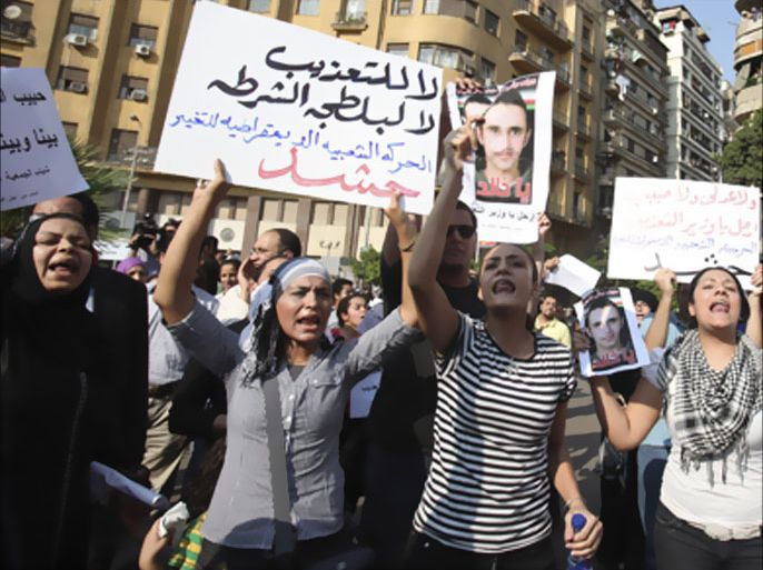 AFP - Supporters of the left-wing organisation Kefaya (Enough) and the Egyptian Committee Against Torture stage a protest in Cairo 21 July 2005 against the regime of President Hosni
