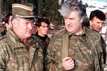 REUTERS/ Former Bosnian Serb wartime leader Radovan Karadzic (R) and his general Ratko Mladic talk on the central Bosnian Mt. Vlasic in this April 1995 file photo. The wife of the Bosnian