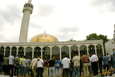 f: Muslims stand at London's Central Mosque in Regents Park during Friday prayers,