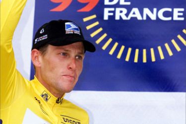 A file picture taken 21 July 1999 of the yellow jersey American Lance Armstrong waving on the podium of the 16th stage of the 86th Tour de France in Pau in the Pyrenees.