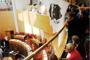 AFP / Nationalists from the Union for Corsican Workers (STC) demonstrate inside Corsica's regional assembly, 29 September 2005, to protest against the arrest of four union-