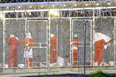AFP (FILES) Detainees prepare themselves for the evening prayer 04 March 2002 at Camp X-Ray in Guantanamo Bay, Cuba. A hunger strike at the US military's prison camp at