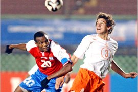 epa00536826 Gambia player Ousman Jallow (L) fights for the ball with Dirk Marcellis (R) from Holland during the match for the U17 Soccer World Cup held at National Stadium