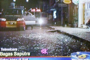 afp: This TV grab from SCTV shows broken glass at a bomb blast site in Bali 01 October 2005. At least eight people, including four foreigners, were killed when two near simultaneous explosions went off in the popular Indonesian resort island of Bali, radio reports said 01 October. RESTRICTED TO EDITORIAL USE AFP PHOTO/TV GRAB/SCTV