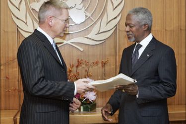 afp - This image released by the United Nations shows United Nations International Independent Investigation Commissioner Detlev Mehlis (L) as he hands a report