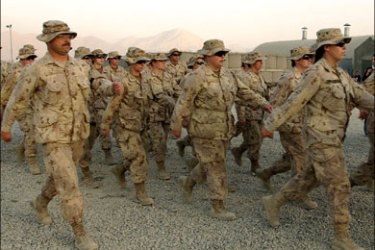 afp - Canadian soldiers march after a ceremony at Camp Julien in Kabul, 21 October 2005. The Canadian military ceremony marked the transfer of Canada's defence